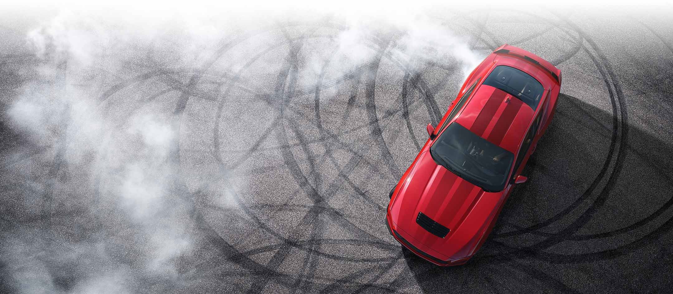 Overhead view of a 2024 Ford Mustang® model with tire tracks on pavement | Davis Ford Sales, Inc. in Fulton MS