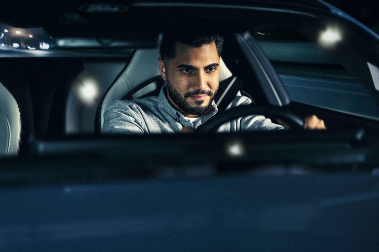 Person sitting in the driver’s seat of a parked 2024 Ford Mustang® coupe | Davis Ford Sales, Inc. in Fulton MS